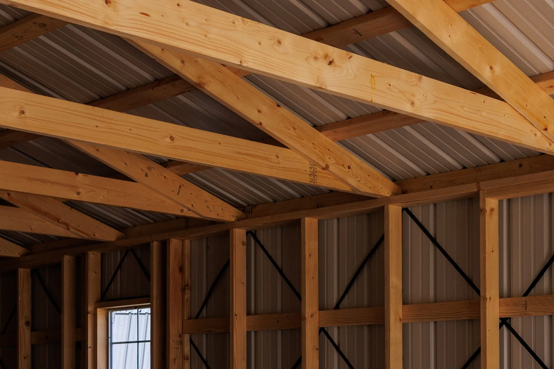 Wood rafters and truss joints under the metal roof of a Hawthorn building